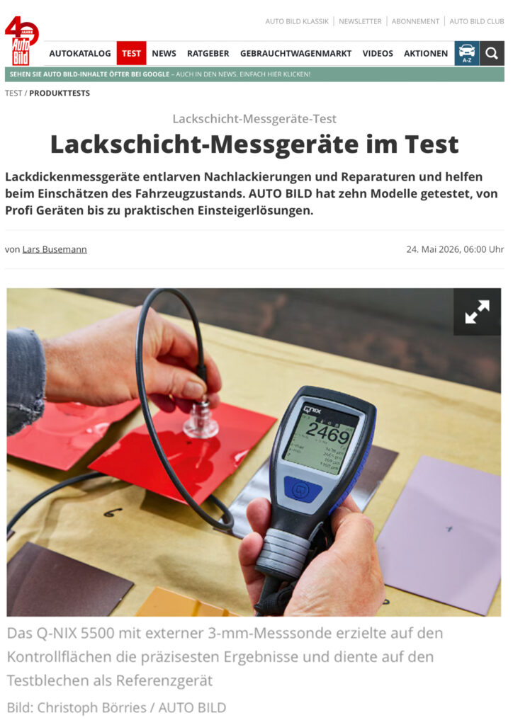 Q-NIX 5500 paint thickness gauge with external probe on red test surfaces in AUTO BILD test